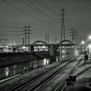Bridge Towers And Train Lines - Down By The River